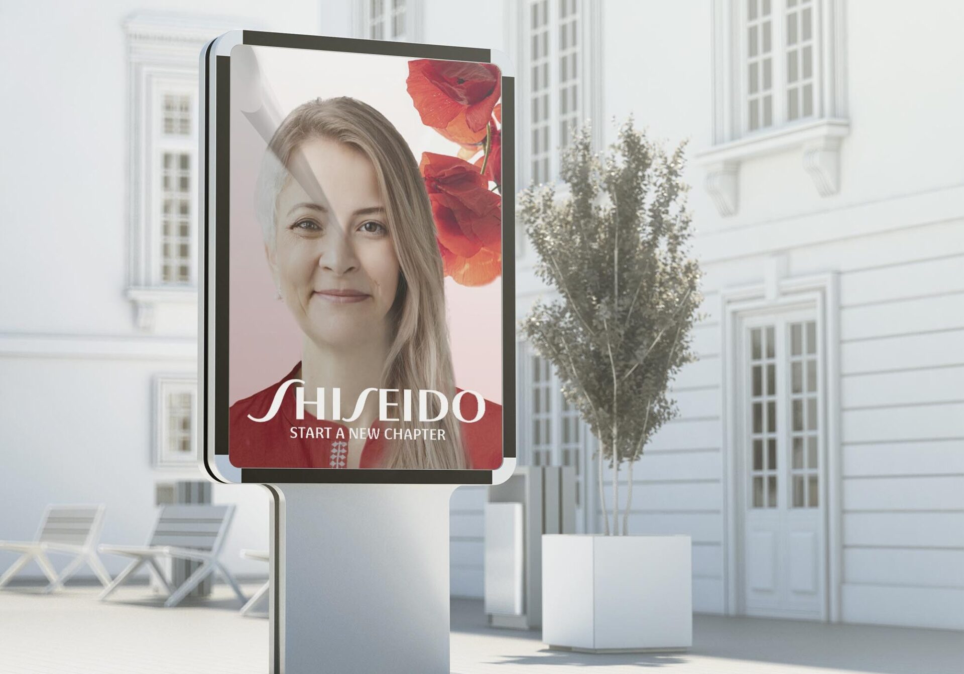 A screen is displaying a woman, half old and half young, in book pages to symbolize a new chapter.